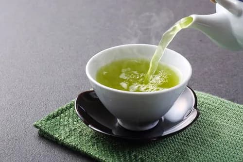 Green tea being poured