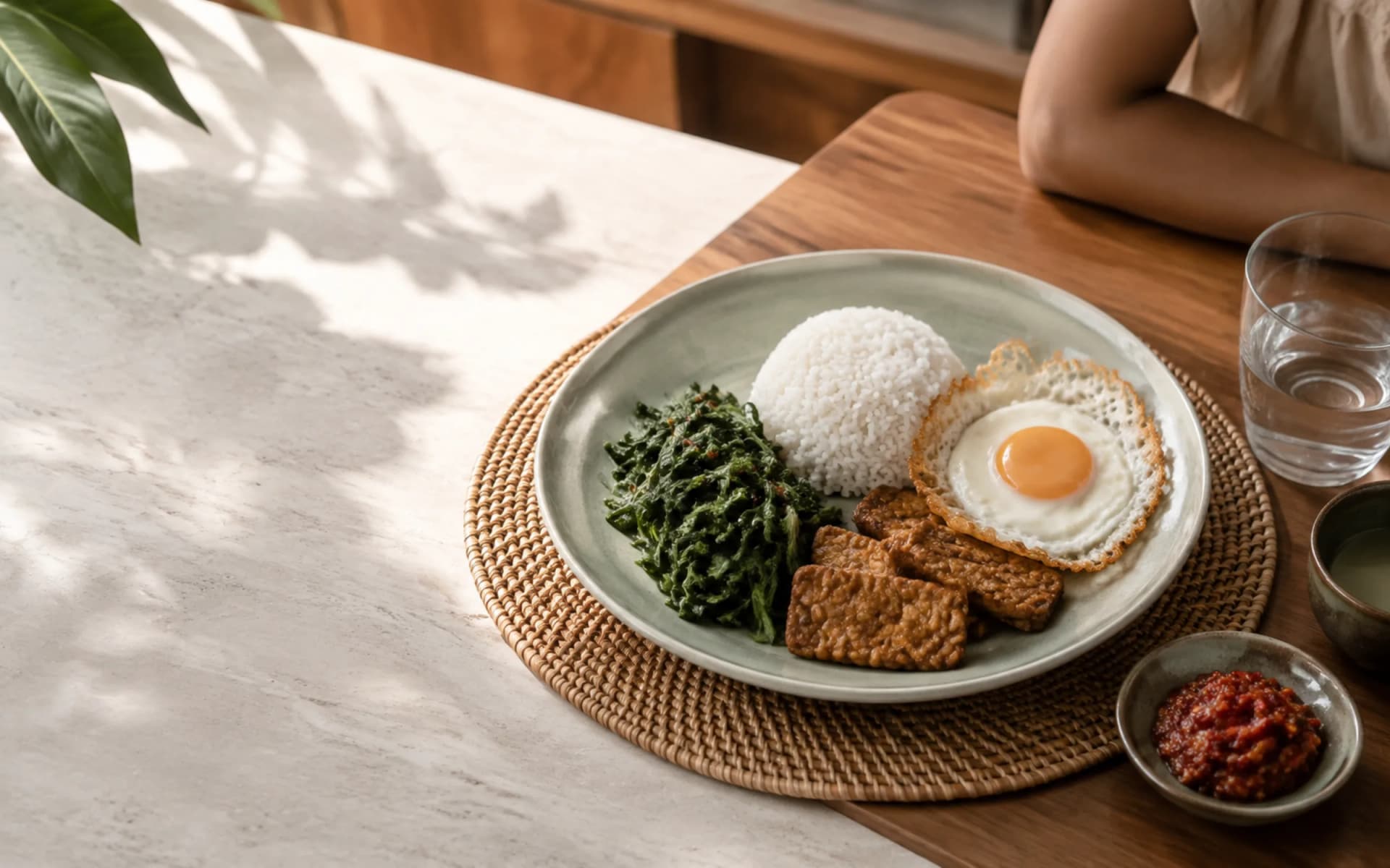 A breastfeeding Mama's breakfast plate: rice, egg, vegetables and tempeh