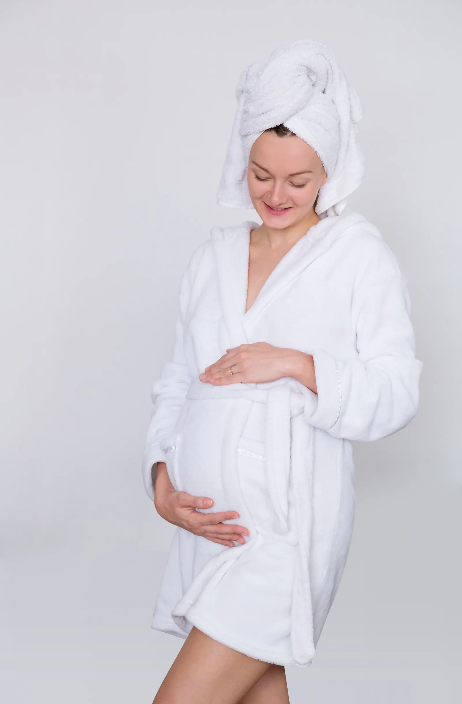 Pregnant woman in a bathrobe