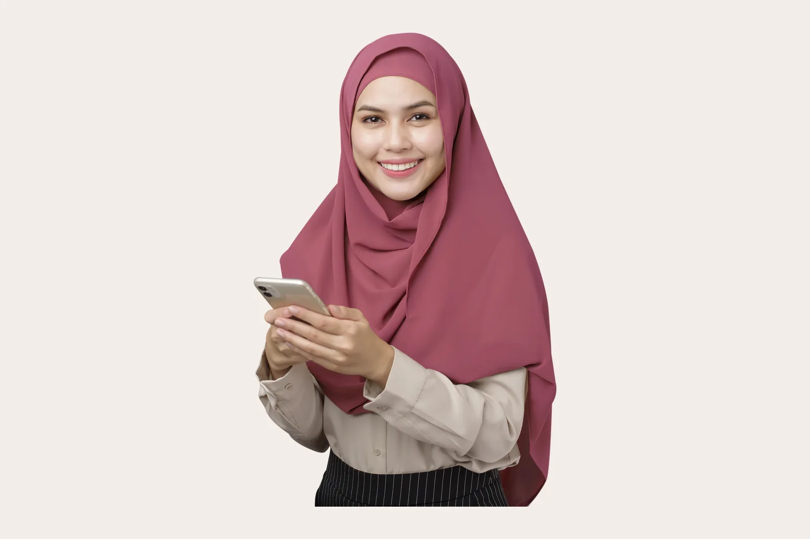 Perempuan berhijab memegang ponsel