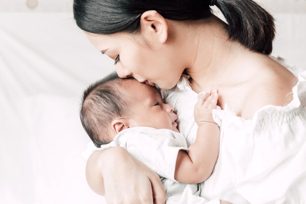 Mama breastfeeding baby during corona pandemic
